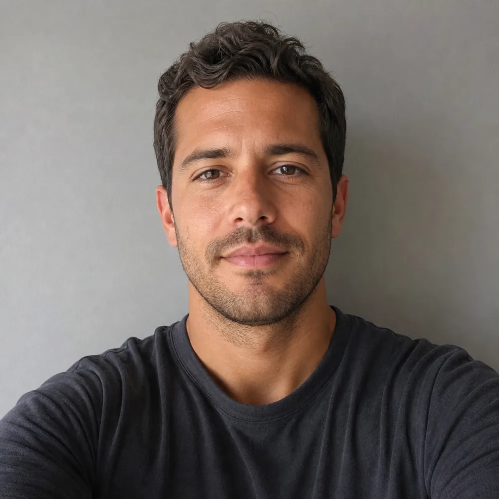 Noah before, with short dark hair and stubble